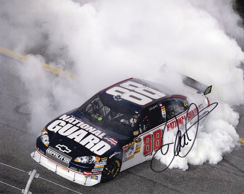 Signed 8x10 picture of Dale Earnhardt Jr.’s 2008 Bud Shootout victory burnout at Daytona, featuring the #88 National Guard car surrounded by thick white smoke. The dramatic celebration captures the energy of Jr.’s win. A perfect display piece and a great gift for fans. We are always here to help with any questions.
