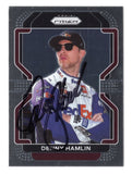 Autographed Denny Hamlin 2022 Panini Prizm Racing #11 FedEx NASCAR trading card with Certificate of Authenticity and a rigid, plastic toploader included for protection and display. A premium collectible that makes a great gift for racing fans and memorabilia collectors.