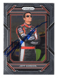 Front view of an autographed Jeff Gordon 2023 Panini Prizm Racing NASCAR trading card featuring his memorable #24 AARP Drive to End Hunger Hendrick Motorsports Chevrolet and distinctive Panini Prizm design. This signed collectible includes a Certificate of Authenticity and appeals to Jeff Gordon fans and NASCAR memorabilia collectors.