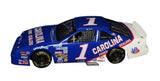 Close-up of the signed 1991 Jeff Gordon #1 Carolina Ford Dealers Busch Car 1/24 scale NASCAR diecast showcasing the authentic autograph, distinctive sponsor graphics, and detailed collector craftsmanship. An eye-catching piece representing the early NASCAR career of four-time Cup Series Champion Jeff Gordon.