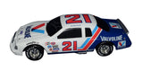 Rare signed Buddy Baker Valvoline NASCAR diecast from 1995 showcasing the iconic #21 paint scheme, black window bank construction, Action Performance craftsmanship, and limited production of only 5,004 pieces for collectors.