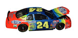Collectible autographed Jeff Gordon 1997 #24 DuPont Rainbow Warrior Revell 1/24 scale NASCAR diecast featuring the legendary paint scheme associated with Gordon's championship era. This signed loose car exhibits paint cracking and is offered as a vintage collectible for fans who appreciate classic NASCAR memorabilia and display pieces.