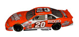 Close-up of the signed 1999 Tony Stewart #20 Home Depot Rookie Action 1/24 NASCAR diecast showcasing the authentic autograph, bright orange No. 20 paint scheme, detailed sponsor graphics, and classic collector craftsmanship. An outstanding display piece celebrating Stewart's memorable 1999 NASCAR Cup Series rookie season.