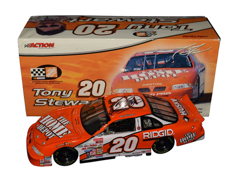 Autographed 2000 Tony Stewart #20 Home Depot Racing Clear Window Bank diecast featuring the classic orange scheme, detailed construction, and included COA. A vintage Winston Cup collectible that makes a great gift for NASCAR fans. We are always here to help with any questions.