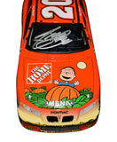 Collectible autographed Tony Stewart 2002 #20 It's the Great Pumpkin Charlie Brown Action 1/24 scale NASCAR diecast featuring a distinctive Peanuts-themed paint scheme and authentic signature from the three-time Cup Series Champion. This special racing collectible offers excellent display appeal for NASCAR and Peanuts memorabilia collectors.