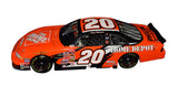 Close-up of the signed 2002 Tony Stewart #20 Home Depot Championship Season Action 1/24 NASCAR diecast showcasing the authentic autograph, bright orange No. 20 paint scheme, detailed sponsor graphics, and classic Action craftsmanship. An outstanding collectible honoring Stewart's first NASCAR Cup Series title with Joe Gibbs Racing.