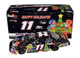 Autographed 2007 Denny Hamlin #11 FedEx Happy Holidays diecast featuring Sam Bass artwork, festive Christmas graphics, and included COA. A rare seasonal NASCAR collectible that makes a great gift. We are always here to help with any questions.