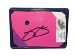Displayed autographed Jimmie Johnson #48 Ally Racing pink race-used NASCAR sheet metal featuring visible racing wear and Hendrick Motorsports styling. Housed inside a protective plastic toploader, this trading-card-size collectible makes a great gift for Jimmie Johnson fans and motorsports memorabilia collectors.