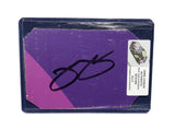 Displayed autographed Jimmie Johnson #48 Ally Racing two-color purple race-used NASCAR sheet metal with visible track wear and Hendrick Motorsports styling. Housed inside a protective plastic toploader, this trading-card-size collectible makes a great gift for Jimmie Johnson fans and racing memorabilia collectors.