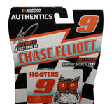 Close-up view of the autograph on the 2022 Chase Elliott #9 Hooters Racing NASCAR Authentics 1/64 scale diecast. The Wave 03 collectible highlights Elliott’s signature, bold orange Hooters graphics, Hendrick Motorsports styling, and detailed NASCAR racing design.