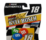 Signed Kyle Busch #18 M&M’s 2022 NASCAR Authentics Wave 03 diecast car in 1/64 scale featuring the recognizable candy-themed Joe Gibbs Racing paint scheme. Hand-signed by Kyle Busch and accompanied by a COA, this collectible represents the final season of the longtime Busch and M&M’s NASCAR partnership.