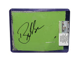 Displayed autographed Bubba Wallace #23 DraftKings Racing green composite NASCAR sheet metal from the 2023 Crayon 301 Loudon car. Housed inside a protective plastic toploader, this trading-card-size race-used collectible makes a great gift for Bubba Wallace fans and motorsports memorabilia collectors.