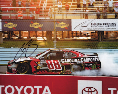 Autographed 2024 Connor Zilisch #88 Carolina Carports Watkins Glen burnout photo featuring his signature, race-winning celebration smoke, and the vibrant detail of the #88 car. A standout collectible for NASCAR fans and a great gift. We are always here to help with any questions.