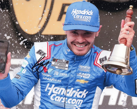 Autographed 8x10 photo of Kyle Larson celebrating his 2024 Indy Brickyard win in Victory Lane while ringing the Victory Bell beside the #5 Hendrick Motorsports Chevy. A memorable collectible that makes a great gift, and we are always here to help with any questions.