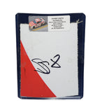 Displayed autographed Sammy Smith #8 Pilot Flying J Racing composite NASCAR sheet metal from the 2024 Loudon Xfinity car with visible racing wear. Housed inside a protective plastic toploader, this trading-card-size collectible makes a great gift for Sammy Smith fans, Loudon enthusiasts, and racing memorabilia collectors.