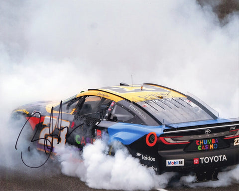 Autographed 8x10 photo of Bubba Wallace performing his 2025 Indy Brickyard burnout in the #23 Chumba Casino car. The bold signature and smoky celebration make it a standout collectible for NASCAR fans. It makes a great gift, and we are always here to help with any questions.