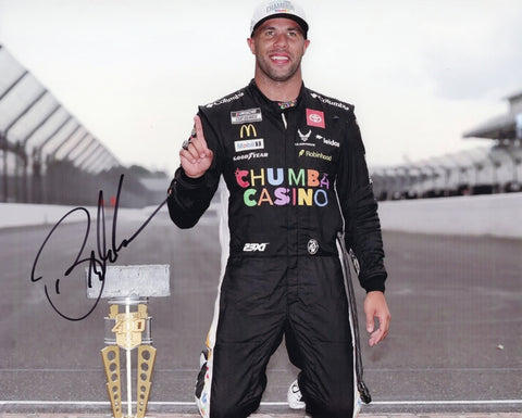 Autographed 8x10 photo of Bubba Wallace celebrating his 2025 Indy Brickyard win while holding the trophy at the historic Yard of Bricks. The clear signature enhances its collectible appeal. It makes a great gift for NASCAR fans, and we are always here to help with any questions.
