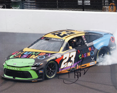 Autographed 8x10 photo of Bubba Wallace performing his 2025 Indy Brickyard Victory Burnout in the #23 Chumba Casino car. Smoke surrounds the vehicle as he celebrates an iconic win. The clear signature enhances its collectible value. It makes a great gift, and we are always here to help with any questions.