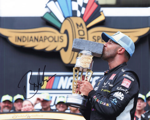 Autographed 8x10 photo of Bubba Wallace celebrating his 2025 Indy Brickyard win while holding the Victory Lane trophy beside the #23 Chumba Casino car. The clear signature adds strong collectible appeal. It makes a great gift for NASCAR fans, and we are always here to help with any questions.