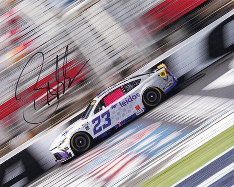 Autographed 8x10 photo of Bubba Wallace driving the 2025 #23 Leidos Racing Toyota at the Charlotte Roval for 23XI Racing. The image shows the vibrant Leidos scheme with his clear signature enhancing collectible appeal. It makes a great gift, and we are always here to help with any questions.