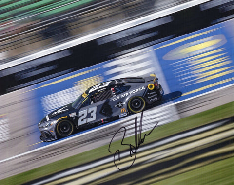 Signed 8x10 photo of Bubba Wallace driving the 2025 #23 United States Space Force Toyota during the Kansas race, featuring a bold military-themed design. The autograph adds collectible appeal, and it makes a great gift. We are always here to help with any questions.