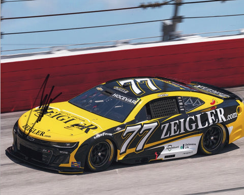 Autographed 2025 Carson Hocevar #77 Ziegler Racing Darlington photo featuring his Spire Motorsports Chevrolet, clear signature, and the classic Darlington throwback theme. A vibrant NASCAR collectible that makes a great gift. We are always here to help with any questions.