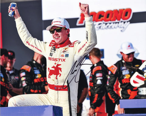 Autographed 8x10 2025 Connor Zilisch Pocono Race Win photo featuring the #88 Registix Racing car with Dale Jr. as crew chief. The vibrant glossy image shows Zilisch celebrating with a clear signature. A great gift for NASCAR collectors, and we are always here to help with any questions.