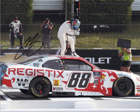 Autographed 8x10 photo of Connor Zilisch celebrating his 2025 Pocono Win in the #88 Registix Racing car during the memorable race where Dale Jr. served as crew chief. The bold autograph and COA add collector value. It makes a great gift, and we are always here to help with any questions.