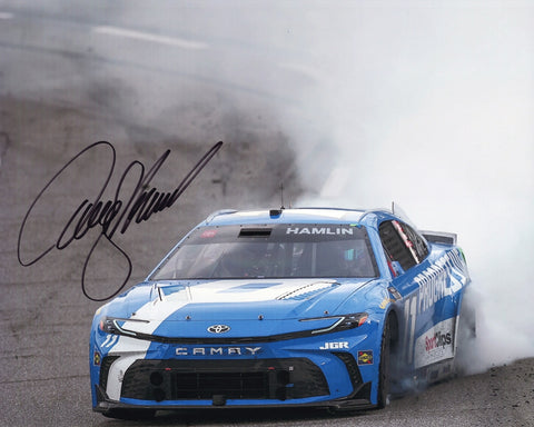 Autographed 8x10 photo of Denny Hamlin performing a burnout after his 2025 Martinsville victory in the Progressive Racing No. 11 car. Smoke surrounds the car as he celebrates a memorable win. Makes a great gift for NASCAR fans, and we are always here to help with any questions.