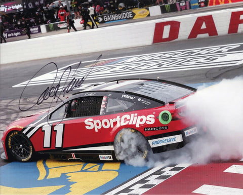 Autographed 8x10 NASCAR photo of Denny Hamlin performing his burnout after winning the 2025 Darlington race in the Sport Clips Toyota. Smoke fills the track as his signature highlights the moment. A great gift for racing fans, and we are always here to help with any questions.