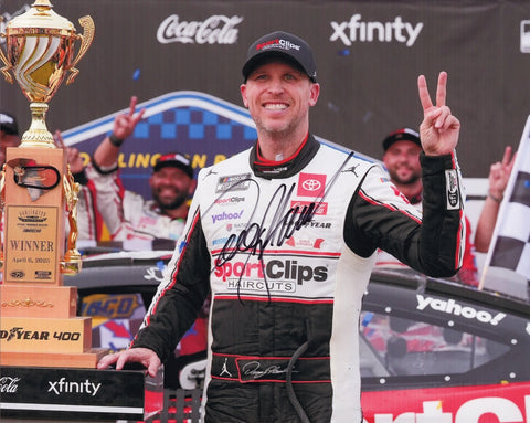Autographed 8x10 NASCAR photo of Denny Hamlin in Victory Lane after winning the 2025 Darlington race, holding the trophy beside his Sport Clips #11 car. The signature is clear and bold, making it a great gift for racing fans. We are always here to help with any questions.