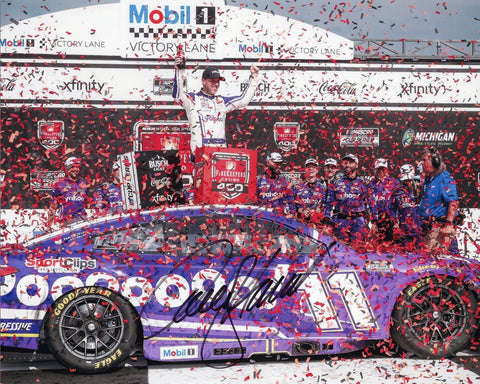 Autographed 8x10 photo of Denny Hamlin celebrating his 2025 Michigan race win in Victory Lane with the #11 Yahoo Racing Toyota. The image features Hamlin smiling with team branding and race-day details visible. It makes a great gift for NASCAR collectors, and we are always here to help with any questions.