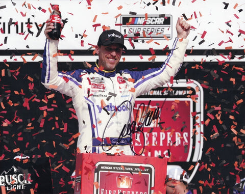 Autographed 8x10 NASCAR photo of Denny Hamlin celebrating his 2025 Michigan win in Victory Lane with confetti flying around him and the #11 Yahoo Racing Toyota. Hamlin’s signature is clearly visible, making it a great gift for fans, and we are always here to help with any questions.