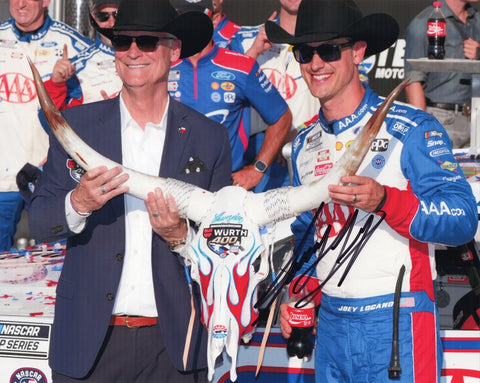 Autographed 8x10 NASCAR photo of Joey Logano celebrating his 2025 Texas Motor Speedway win while wearing the signature cowboy hat trophy beside the #22 AAA Racing Ford. A standout collectible that makes a great gift for fans, and we are always here to help with any questions.