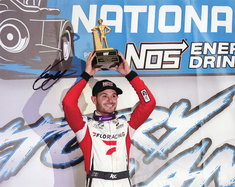 Autographed 8x10 photo of Kyle Larson in Victory Lane with the trophy after winning the 2025 Chili Bowl Nationals in the #1K Flo Racing sprint car. A standout collectible that makes a great gift, and we are always here to help with any questions.