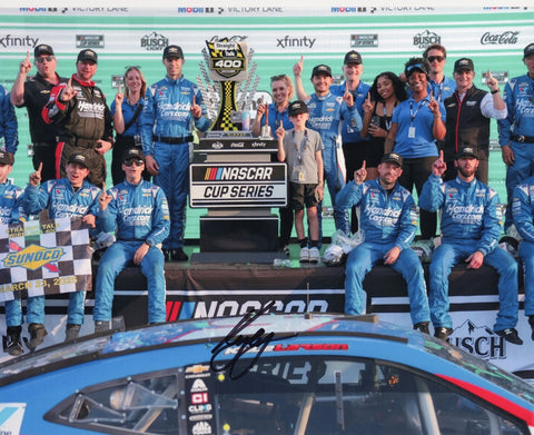 Autographed 8x10 photo of Kyle Larson celebrating his 2025 Homestead-Miami win in Victory Lane with the #5 Hendrick Racing car. This signed NASCAR collectible makes a great gift for fans, and we are always here to help with any questions regarding this standout racing keepsake.