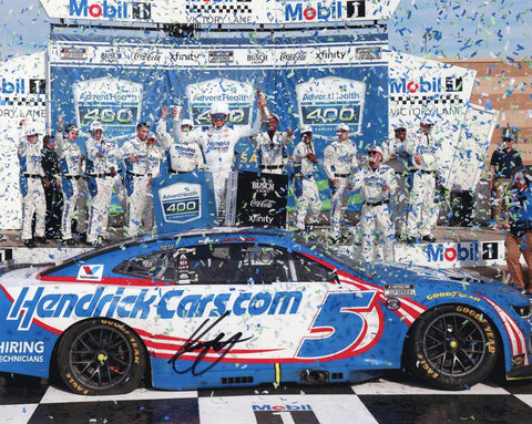 Autographed 8x10 Kyle Larson photo showing his 2025 Kansas Speedway win with confetti falling in Victory Lane beside the #5 Hendrick Racing Chevrolet. This signed NASCAR collectible makes a great gift for fans, and we are always here to help with any questions.