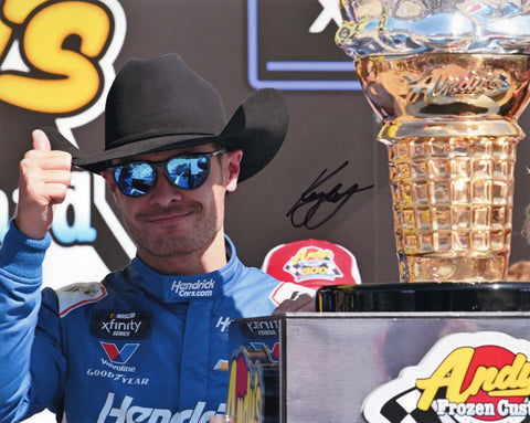 Autographed 8x10 photo of Kyle Larson celebrating his 2025 Texas Xfinity Series win with the #88 Blues Hog car, holding the Victory Lane trophy. A detailed NASCAR collectible that makes a great gift for fans, and we are always here to help with any questions.