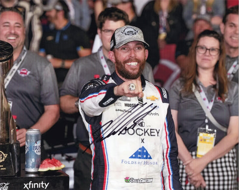 Autographed 8x10 photo of Ross Chastain in Victory Lane after winning the 2025 Coca-Cola 600, holding the winner’s ring while standing beside the #1 Jockey Chevrolet. A standout NASCAR collectible that makes a great gift, and we are always here to help with any questions.
