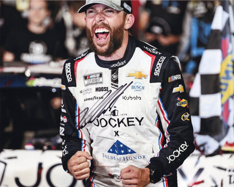 Autographed 2025 Ross Chastain #1 Jockey car photo showing his Coke 600 race win celebration, featuring the driver enjoying the moment after an intense NASCAR victory. Includes his signature and clear race details, making it ideal for collectors. It also makes a great gift, and we are always here to help with any questions.