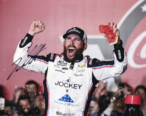 Autographed 8x10 photo of Ross Chastain celebrating his 2025 Coke 600 victory in Watermelon Victory Lane, featuring the #1 Jockey car and his signature post-race moment. A great gift for NASCAR fans and collectors. Includes COA, and we are always here to help with any questions.