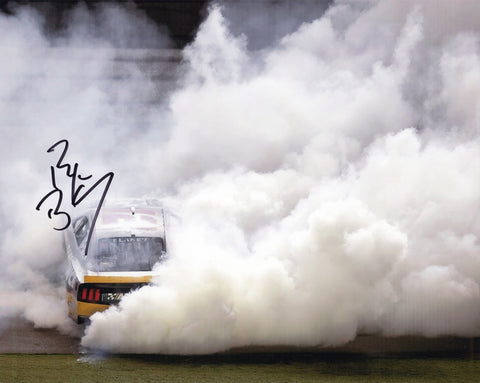 Autographed 8x10 photo of Ryan Blaney performing his 2025 Daytona Night Race Win burnout in the #12 Advance Auto Ford. Shows smoke, sparks, and celebration as Blaney captures a major superspeedway victory. Includes COA and makes a great gift for NASCAR collectors. We are always here to help with any questions.