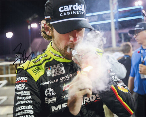 Autographed 2025 Ryan Blaney #12 Menards Nashville Race Win photo featuring Blaney celebrating with a victory cigar after his big win. This signed 8x10 NASCAR collectible includes a COA, makes a great gift for fans, and we are always here to help with any questions.