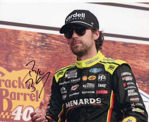 Autographed 2025 Ryan Blaney Nashville Victory Lane photo showing Blaney celebrating after his win beside the #12 Menards car. This signed 8x10 NASCAR collectible comes with a COA, makes a great gift, and we are always here to help with any questions.