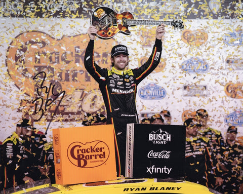 Autographed 2025 Ryan Blaney Nashville Race Win Victory Lane photo showing Blaney proudly holding the Nashville guitar after his big win. This signed 8x10 NASCAR collectible includes a COA, makes a great gift, and we are always here to help with any questions.