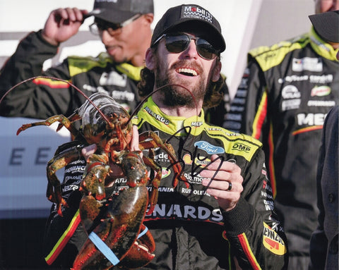 Autographed 2025 Ryan Blaney New Hampshire Race Win photo featuring Blaney holding the famous lobster trophy in Victory Lane. This signed 8x10 NASCAR collectible with COA makes a great gift for fans, and we are always here to help with any questions.