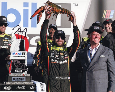 Autographed 2025 Ryan Blaney New Hampshire Victory Lane photo showing Blaney proudly holding the famous lobster trophy after his win. This signed 8x10 NASCAR collectible includes a COA, makes a great gift, and we are always here to help with any questions.