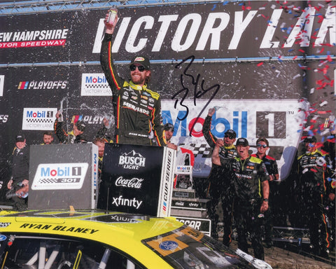 Autographed 2025 Ryan Blaney New Hampshire Victory Lane photo showing Blaney celebrating after his win beside the #12 Menards car. This signed 8x10 NASCAR collectible includes a COA, makes a great gift, and we are always here to help with any questions you may have.