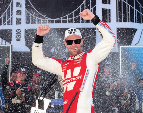 Autographed 2025 Shane Van Gisbergen Chicago Street Race Victory Lane photo showing SVG celebrating beside the #88 WeatherTech car after his win. This signed 8x10 NASCAR collectible includes a COA, makes a great gift, and we are always here to help with any questions you may have.