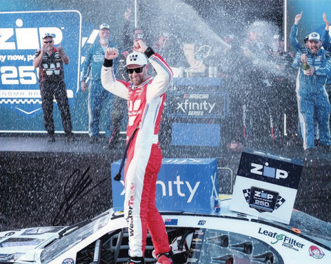 Autographed 2025 Shane Van Gisbergen Sonoma Xfinity Victory Lane photo showing SVG celebrating beside the #97 WeatherTech Racing car after securing the win. This signed 8x10 NASCAR collectible includes a COA, makes a great gift, and we are always here to help with any questions you may have.